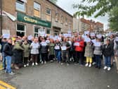The protesters outside the Crispin Arms in Scholes, Wigan