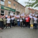 The protesters outside the Crispin Arms in Scholes, Wigan