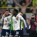 Cole Palmer, Phil Foden and Kobbie Mainoo celebrate England’s semi-final win.