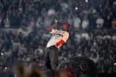 Travis Scott, pictured during his gig at the Tottenham Hotspur Stadium, lit up Co-op Live in Manchester