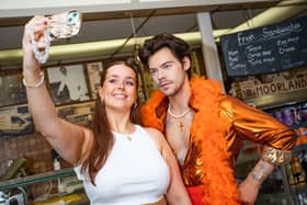 Bethany Wakefield, 26, poses with a waxwork Harry Styles at W. Mandeville Bakery in Holmes Chapel. 