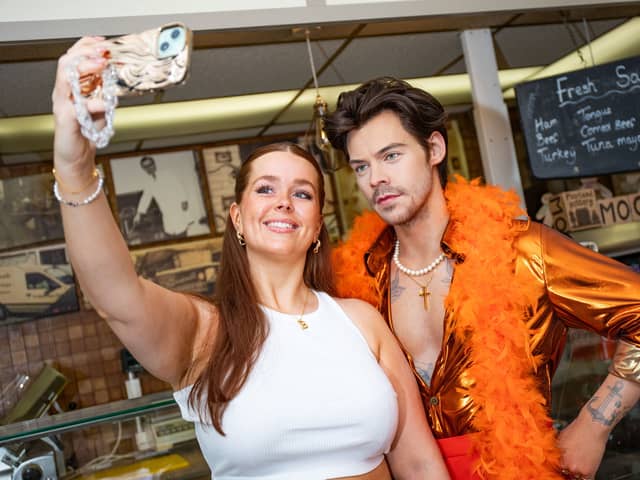 Bethany Wakefield, 26, poses with a waxwork Harry Styles at W. Mandeville Bakery in Holmes Chapel. 