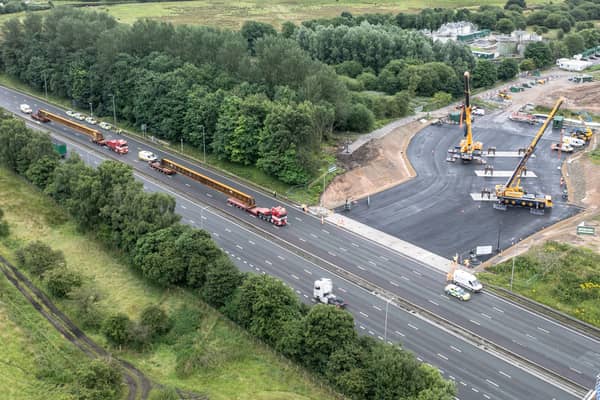 Aerial view of the beams entering the work site on the M62.