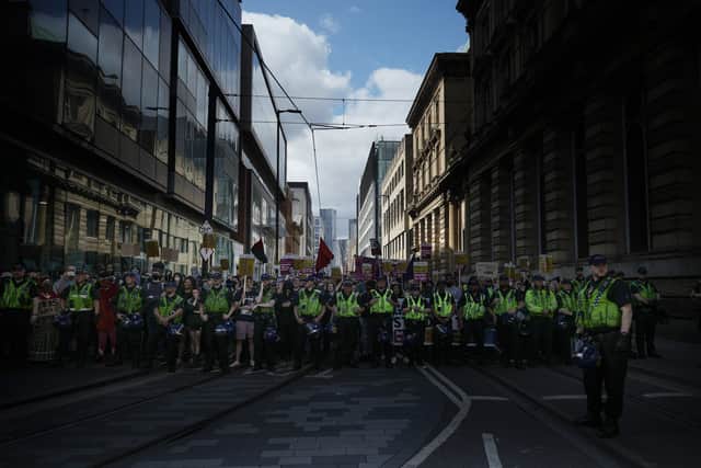Police in Manchester City centre on Saturday. 