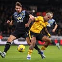 Sander Berge battles for possession with Mario Lemina