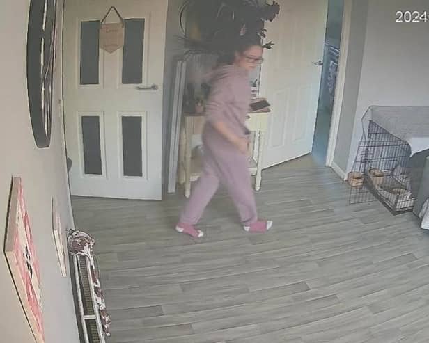 Tia Henderson Entering Her Living Room Credit: Tia Henderson For use by newswire partners
