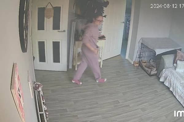 Tia Henderson Entering Her Living Room Credit: Tia Henderson For use by newswire partners