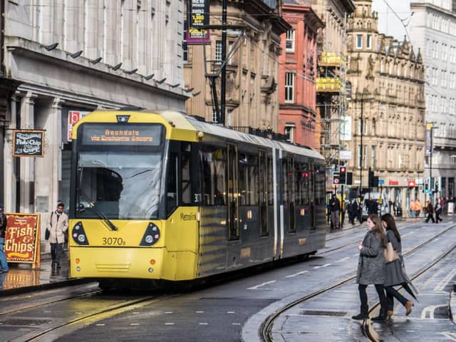 Metrolink tram on Cross St, Manchester city centre