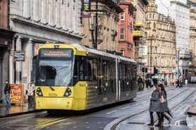 Metrolink tram on Cross St, Manchester city centre
