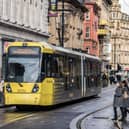 Metrolink tram on Cross St, Manchester city centre