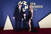 Manchester City's Phil Foden poses on the red carpet with his son Ronnie Foden and his wife Rebecca Cooke Foden 