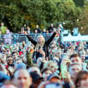 Fans watch Johnny Marr perform at Live From Wythenshawe Park 2024. Credit: Scott M Salt