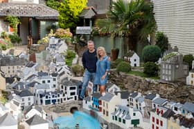 Lee and Julie Gregory with the model of Polperro in Cornwall which is now up for sale.