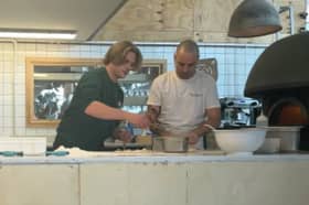 Reporter Theo Hewson Betts get stuck into making a Rudy's pizza 