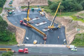 Aerial shot of the beams arriving on the worksite just next to the M62 motorway.