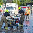 Fire crews at the scene of the flood on Stratford Road.
