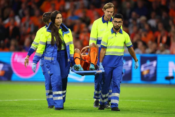Nathan Ake is carried off on a stretcher against Germany.