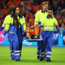 Nathan Ake is carried off on a stretcher against Germany.