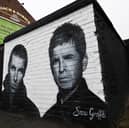 The Oasis mural on the side of the Coach & Horses pub near Heaton Park. 