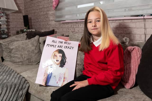 Evie was sent home by teachers who said she needed to dye it back before she could return