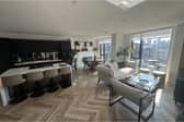 The lounge and kitchen area - complete with stunning views