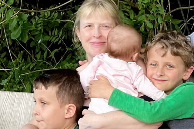Beth Hobson, with children William, Grace and Thomas.