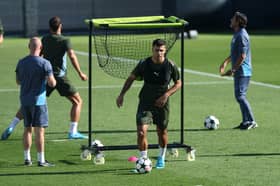 John Stones revealed Rodri was in 'good spirits' when they spoke after the latter's knee surgery.
