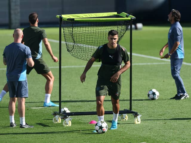 John Stones revealed Rodri was in 'good spirits' when they spoke after the latter's knee surgery.