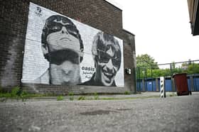 A new Oasis street artwork on the side of the Sifters Records in Burnage. 