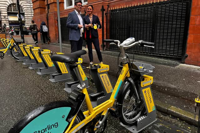 Dame Sarah Storey, the UK's most decorated Paralympian and Greater Manchester's Active Travel Commissioner, shows Mayor Andy Burnham the newest medals in her collection.