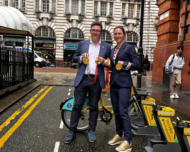 Mayor Andy Burnham and Dame Sarah Storey, wearing gold trainers to match her gold medals