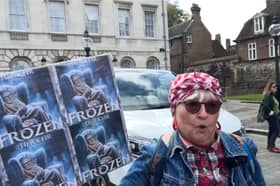 Protester speaks at winter fuel cuts rally.