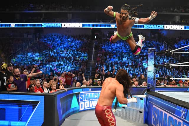 WWE star Santos Escobar flies through the air on an episode of Smackdown