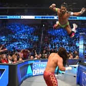 WWE star Santos Escobar flies through the air on an episode of Smackdown 