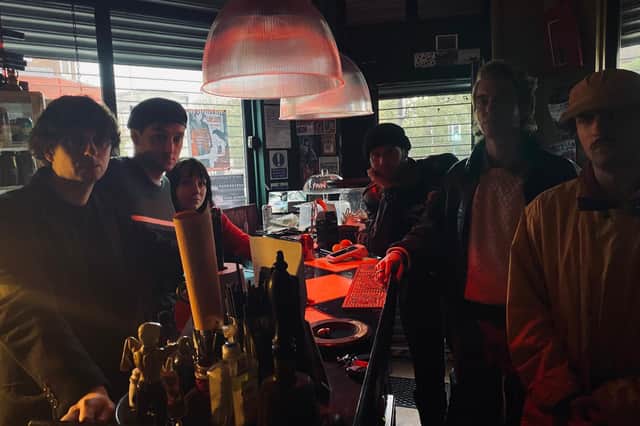 Owners Adam Porrino, front left, and Tess Parkinson, back left, stage a sit-in protest at Café Blah after their landlords allegedly 'changed the locks'.