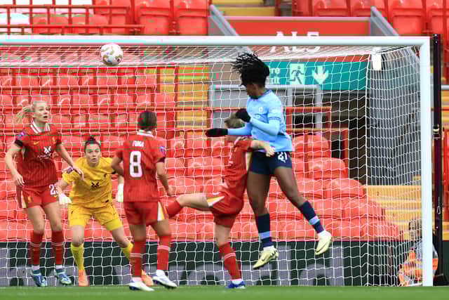 Bunny Shaw heads Manchester City level at Anfield.