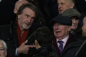 Sir Jim Ratcliffe talks to Sir Alex Ferguson in the Old Trafford directors box