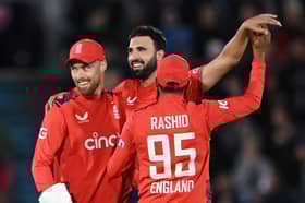 Saqib Mahmood celebrates with Phil Salt. 