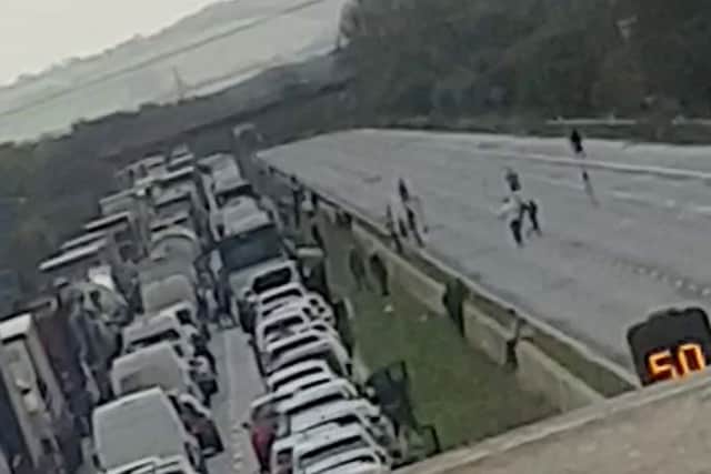 A lorry carrying potentially hazardous chemicals caught fire, shutting the Somerset section between junction 22, at Burnham-on-Sea, and junction 23, from 9.30am. Motorists stuck on the M5 in four mile long queues have abandoned their cars - to play a game of football on the carriageway. 