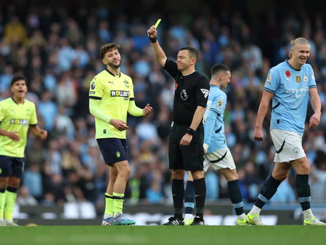 Adam Lallana is shown a yellow card in Manchester City 1-0 Southampton