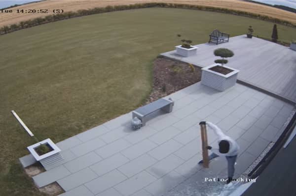 Burglar breaks into home by smashing patio doors with hammer.