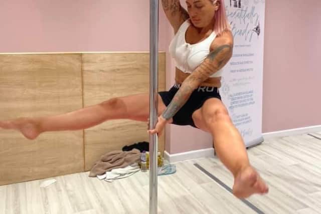 Charlotte Booth doing pole fitness before her liquid BBL treatment 