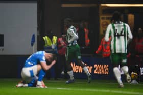 Richard Kone scores Wycombe's third in their 5-0 win at Stockport. 