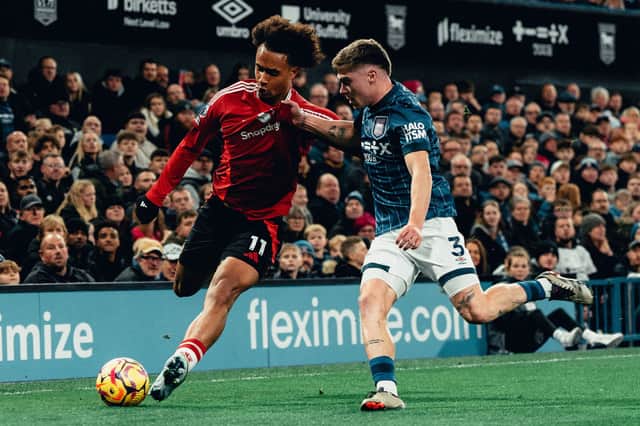 Joshua Zirkzee of Manchester United in action with Leif Davis of Ipswich Town
