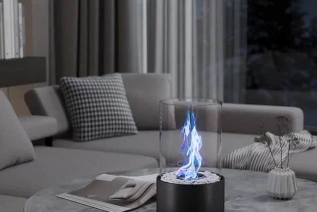 The fire quietly flickers away, warming up the space around it