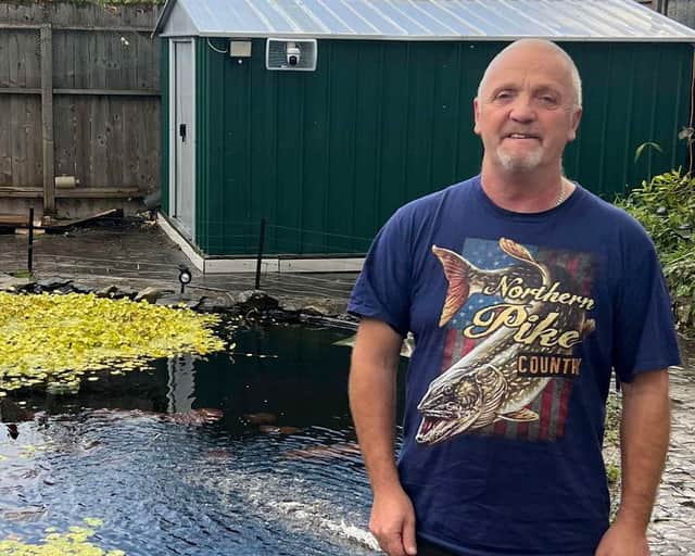 Nigel Cooper and his Koi pond in Ulverston, Cumbria.