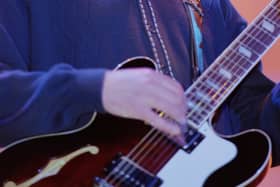 English musician and guitarist Paul 'Bonehead' Arthurs performs live