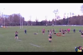 Video grab shows the moment a deer invaded a rugby pitch - and tackled a player. 