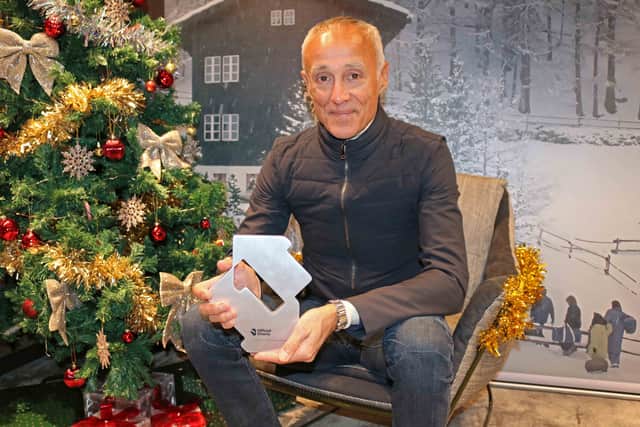 Andrew Ridgeley celebrates Wham! earning the 2024 Christmas Number 1 single for a second year in a row after the announcement on BBC Radio 1 moments ago.