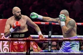 Britain's Tyson Fury (red) and Ukraine's Oleksandr Usyk (blue) compete during their heavyweight world championship rematch on December 22, 2024. Credit: AFP via Getty Images)
